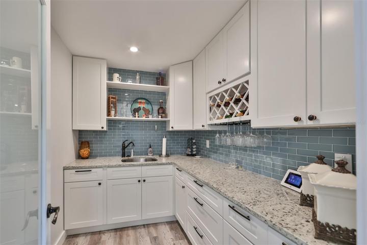 Gourmet Chef's Pantry With Sink, Cabinets & Wine glass Holder