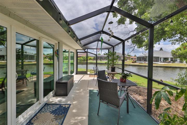 Rear Screened Lanai With Beautiful Pond View, Shade & Marvel at the Visiting Water Fowl