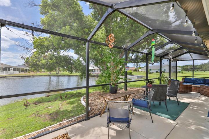 Rear Screened Lanai With Beautiful Pond View Marvel at the Visiting Water Fowl