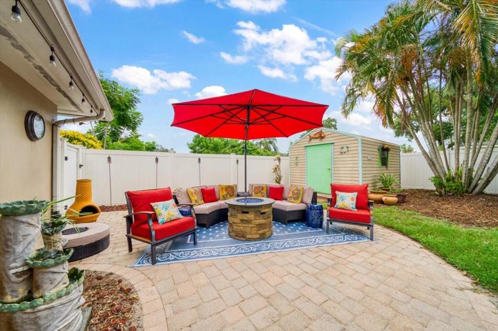 Back patio, perfect for gathering with friends and family and enjoying the Florida weather year round.