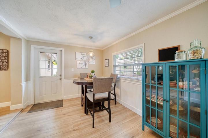 Florida room/ Family room with access to the back patio and yard.
