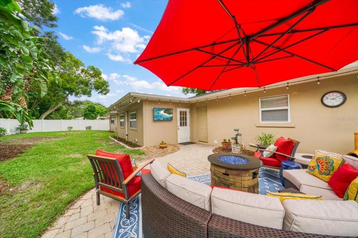 Another view of the back patio and the fenced in yard.