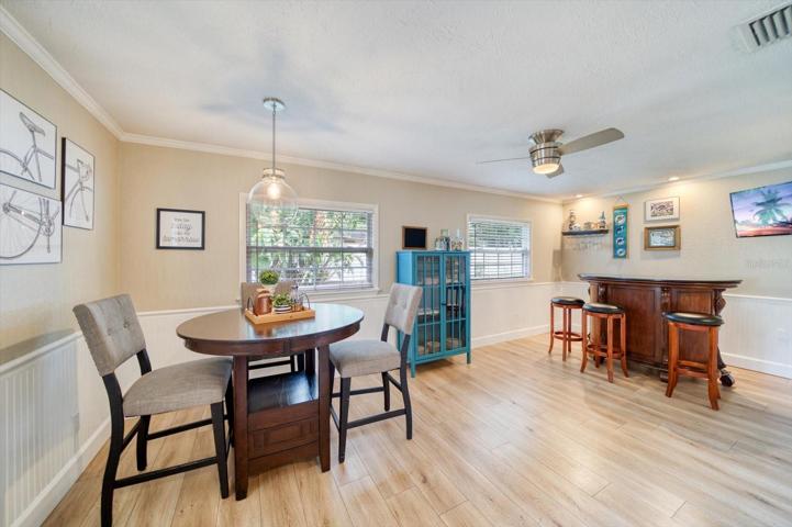 Florida room/ Family room off the kitchen and dining space, with access to the backyard and back patio.