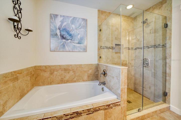 Guest bathroom with separate soaker tub and walk in shower