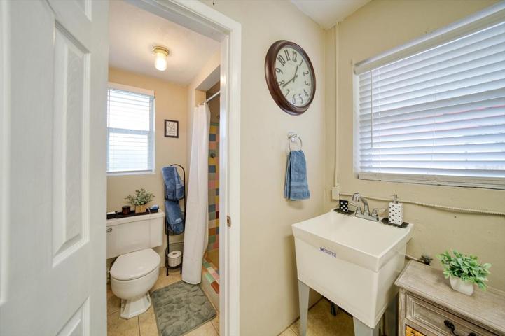 Half bathroom off the garage and laundry room