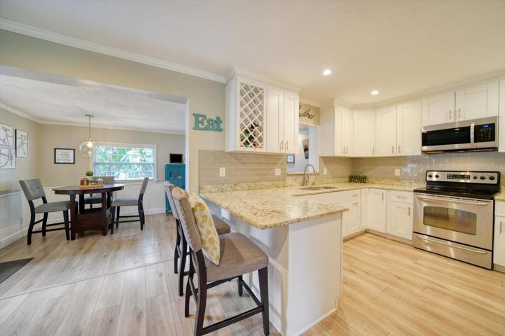 Open concept floor plan- the kitchen opens up to the dining space and the living room, plus the Florida room/ Family room.