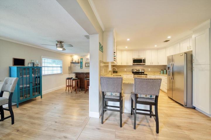 View of the kitchen and Florida room.