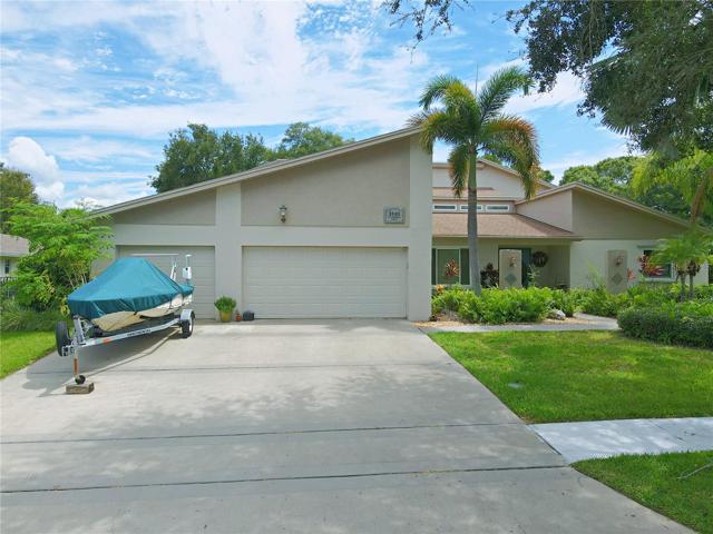 Step into luxury with this 5-bedroom, 5-bath contemporary estate situated on the 2nd fairway of the esteemed Bayhead Course at Countryside Country Club, A members-only sanctuary with 27 exquisite holes awaits.