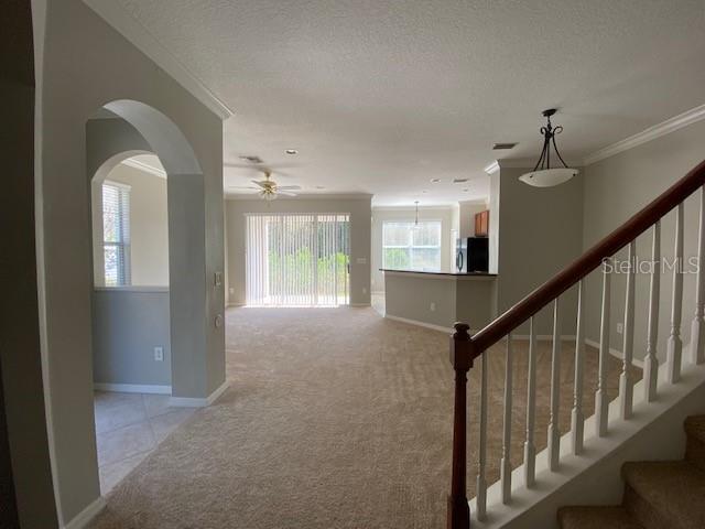 View of Great room and front door entrance from hallway to Garage