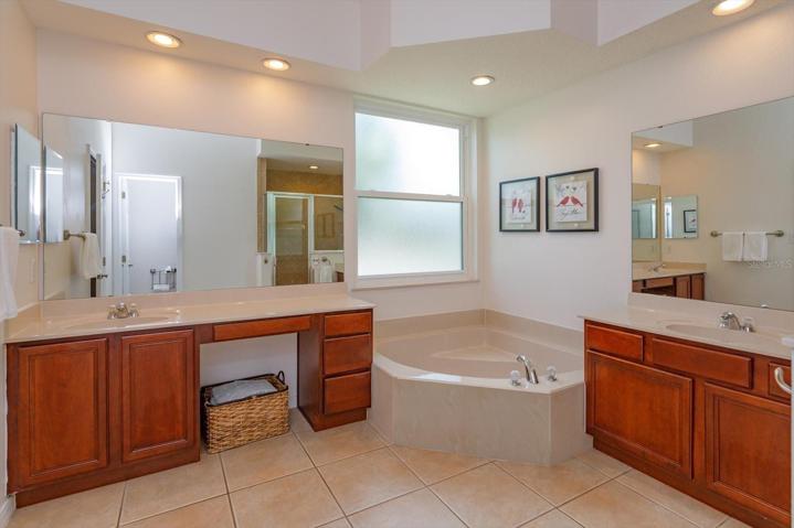 Master en suite has two separate vanities, 2 sinks and a garden soaking tub