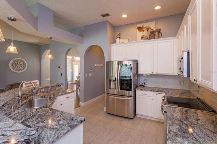 New granite countertops, new tile floors and new appliances