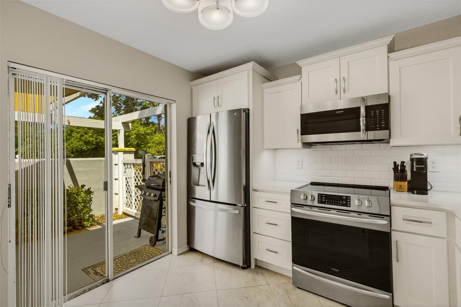 BRAND NEW STAINLESS APPLIANCES WITH BEAUTIFULLY STACKED SOLID WOOD CABINETS WITH CROWN MOLDING