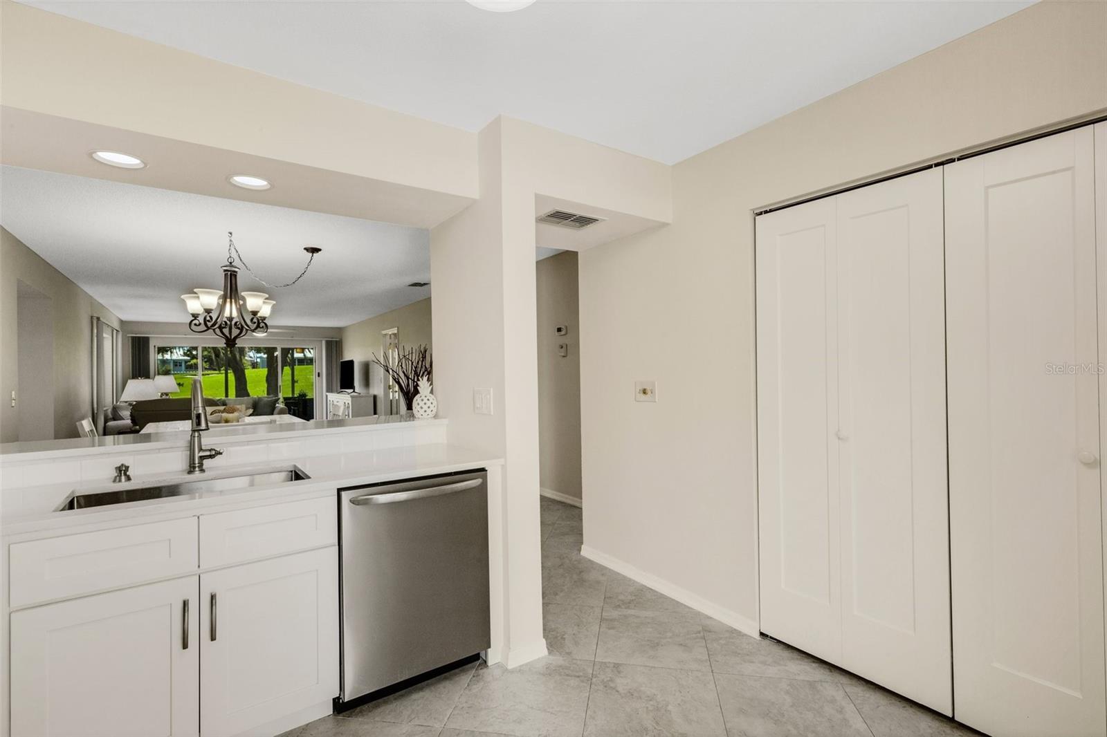 BRAND NEW PANTRY DOORS TO MATCH THE CABINETS WITH TONS OF STORAGE INSIDE