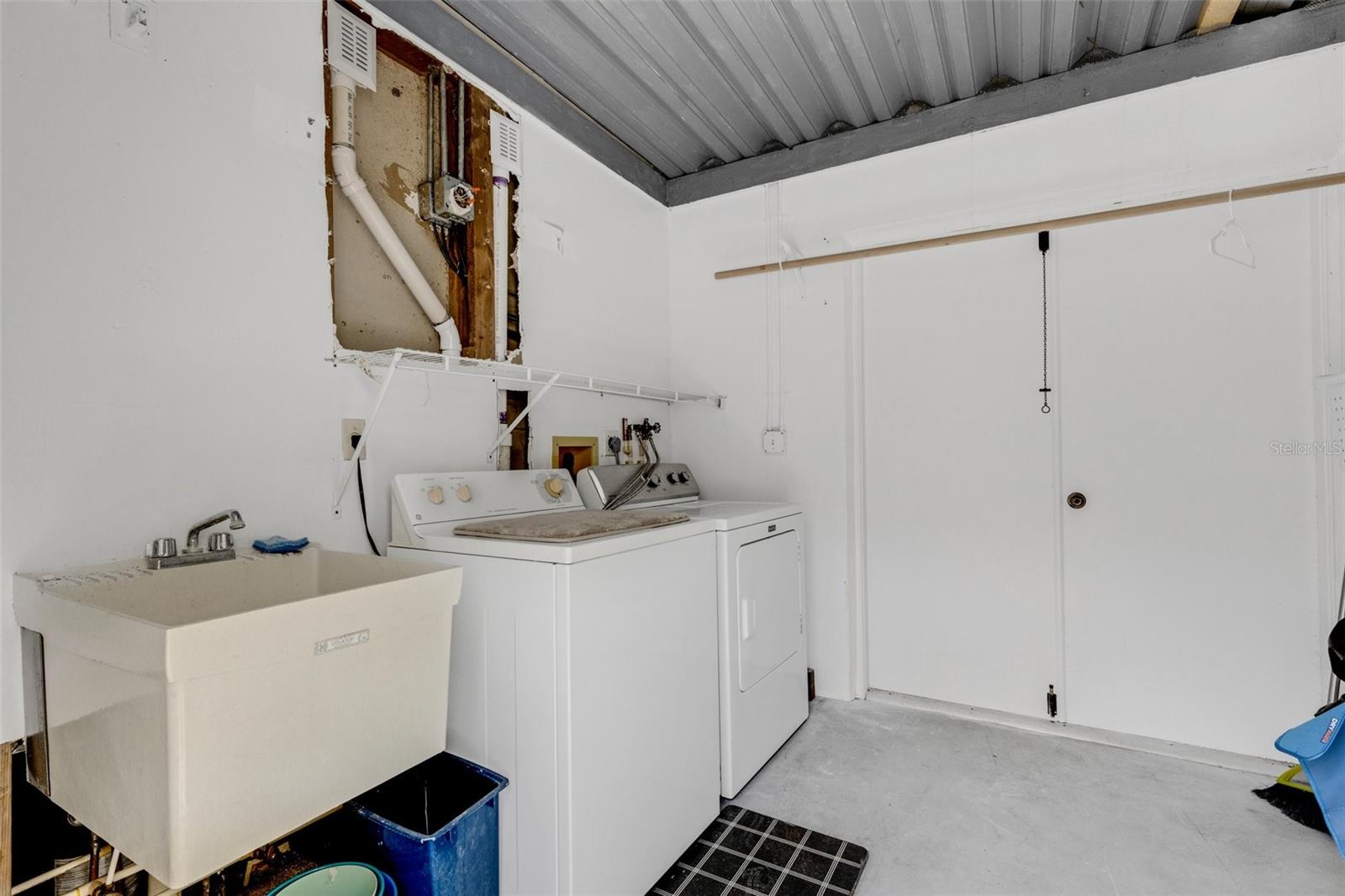 LAUNDREY ROOM, STORAGE AREA AND AN EXTRA REFRIGERATOR/FREEZER