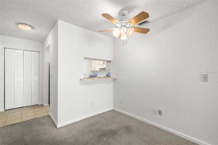 Dining area/bar area with pass through window / pantry to the left