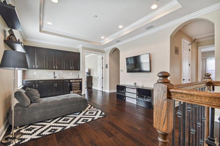 2nd floor loft with wet bar, cabinets, and wine refrigerator