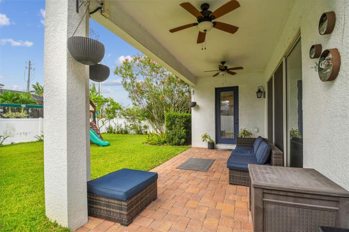 Covered lanai with fenced backyard