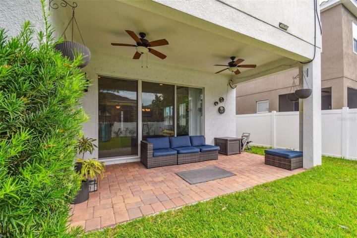 Covered lanai with fenced backyard