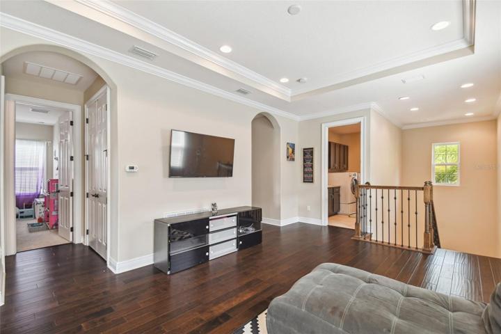2nd floor loft with wet bar, cabinets, and wine refrigerator