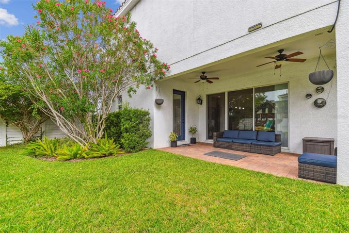 Covered lanai with fenced backyard