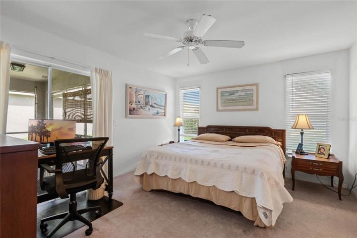 Glass sliding Doors leading to the Lanai from the Master Bedroom Suite