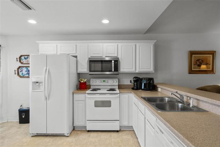 White Cabinetry w/ Crown Molding Trim