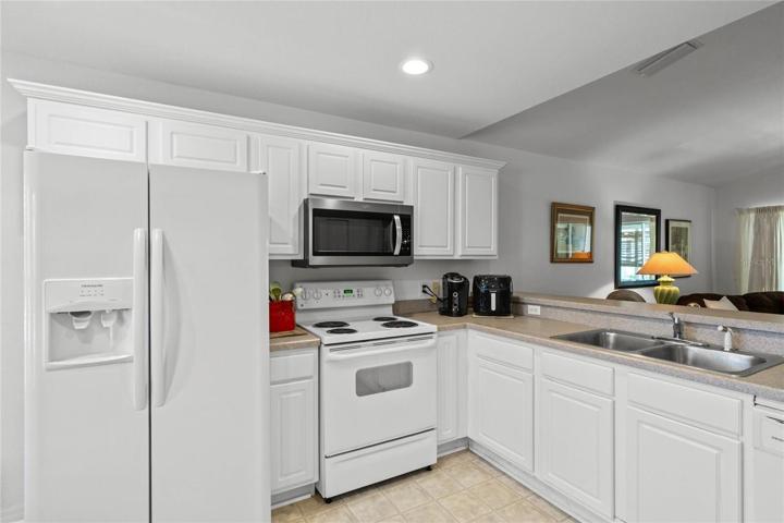 Kitchen features recessed lighting