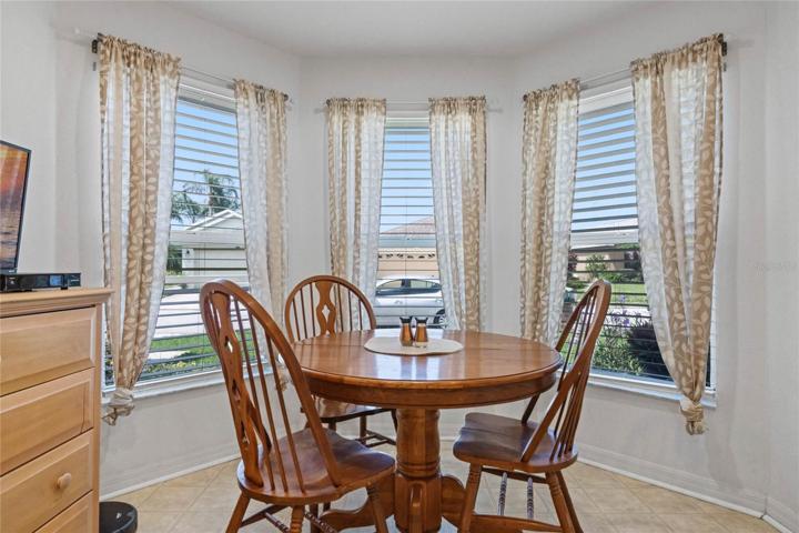 Charming Breakfast Nook that is surrounded by a bay of windows