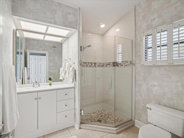 Bathroom #2 with walk in shower, en suite bath for bed #2