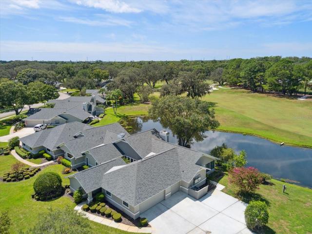 Villa is on the end with pond view and #2 fairway, you can see the 2 car garage with 3rd for your golf cart