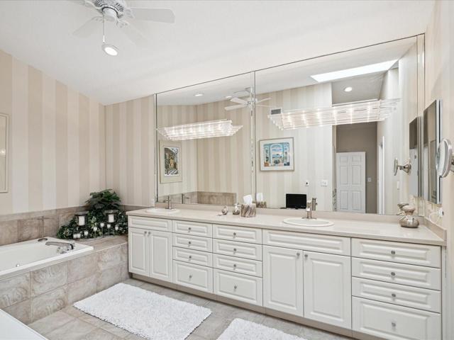 Master Bathroom with dual sinks and jetted tub