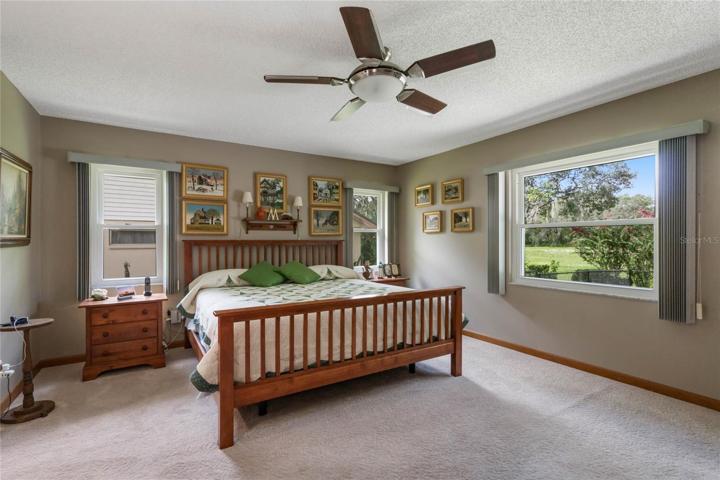 Master Bedroom offers serene views of backyard