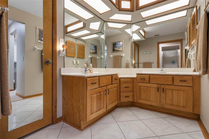 Master Bathroom w/ Oak Cabinetry & Dual Sinks