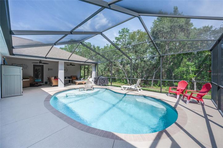nearly 32'x24' deck and pool area, plus additional 23'x12' covered lanai in background