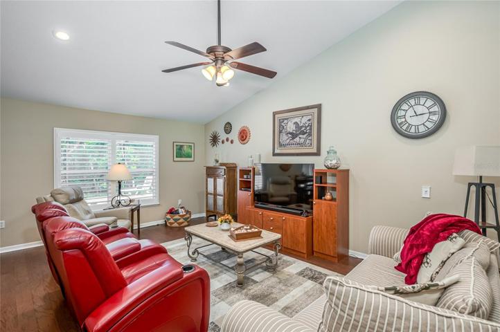 Family room from center of common living space with new plantation shutters