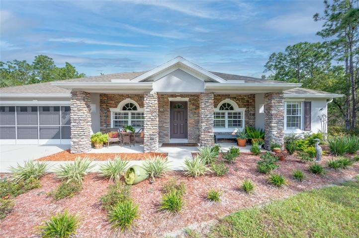 Eye-catching front of home with new landscaping!
