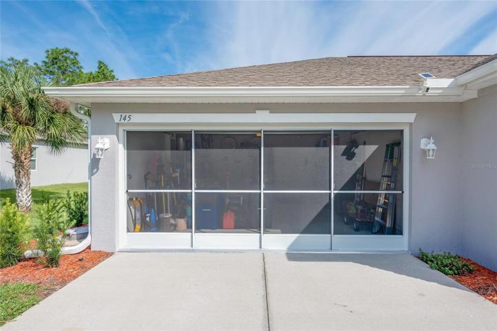 Sliding-screen panels installed across garage entry!