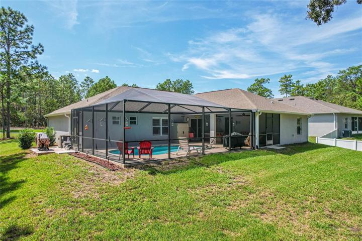 Rear of home with enormous lanai and pool area!
