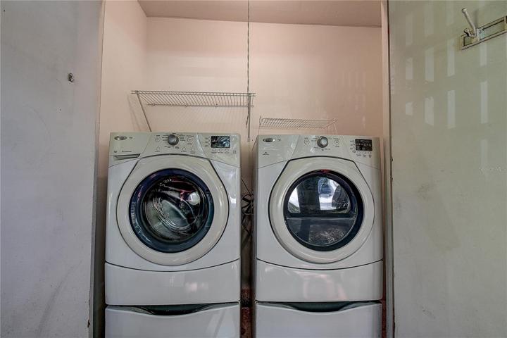 Laundry closet with washer and dryer