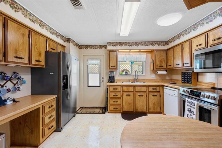 From carport entering into this updated kitchen.
