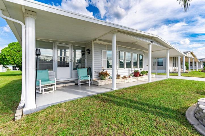 This home offers a nice side Florida room.