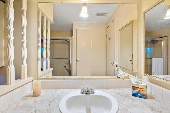 Guest bath has tub/shower combo.