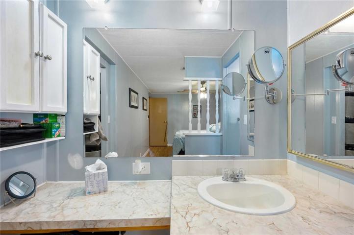 Master bath has step-in shower and is open with master bedroom.
