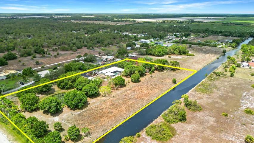 ariel view from SE corner property line extends halfway across canal