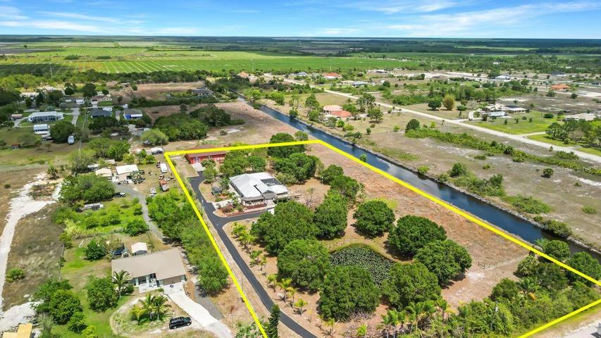 ariel view SE corner from  street entrance property line extends halfway across canal