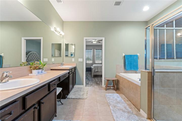 Master Ensuite with double sinks and wood cabinets