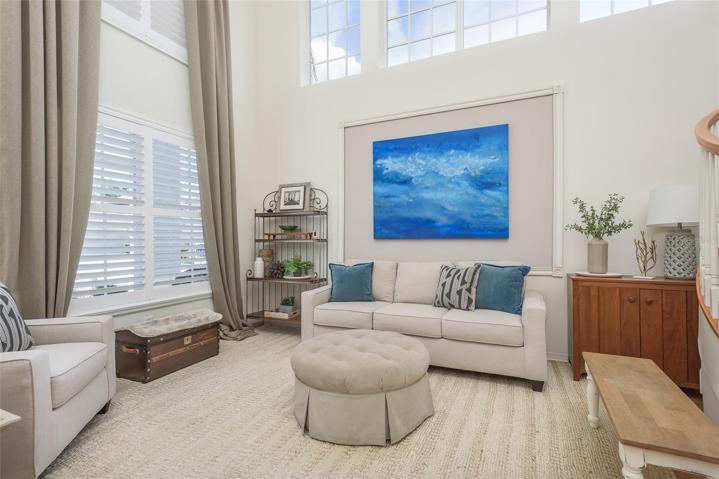 Formal Living Room With Expansive High Ceilings & Windows