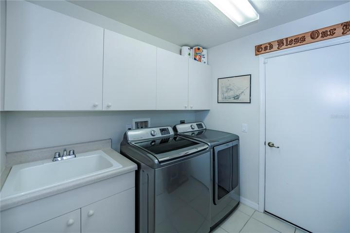 lots of cabinetry in the inside laundry