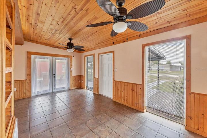 FROM DINING AREA LOOKING TOWARD FRENCH DOORS IN LIVING ROOM