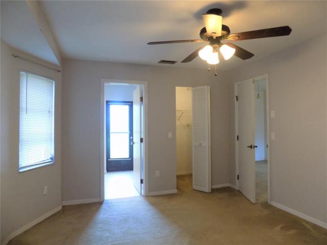 Primary bedroom with walk in closet and en suite bathroom